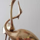 Couple of wading birds in brass on wooden base