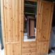 Wardrobe three doors, one with mirror, three drawers in solid pine wood