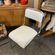 Pair of chrome chairs upholstered in boucle fabric.