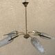 Brass and moulded glass chandelier, Bakelite arrow, 1950s, 5 lamps.