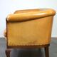 Unique old set of 2 club armchairs and a couch in cognac-colored leather with wheels