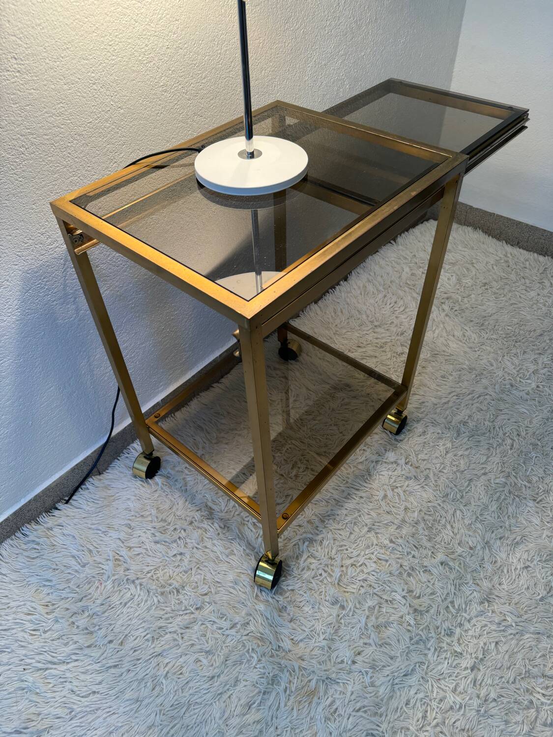 Brass rolling trolley with smoked glass from the 70s