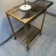 Brass rolling trolley with smoked glass from the 70s