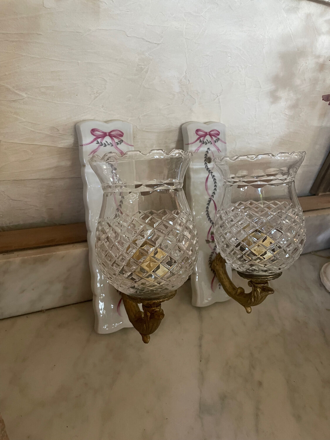 Pair of cut glass and Limoges porcelain wall sconces