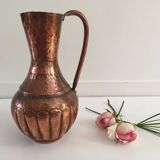 Pitcher-shaped vase in hammered copper