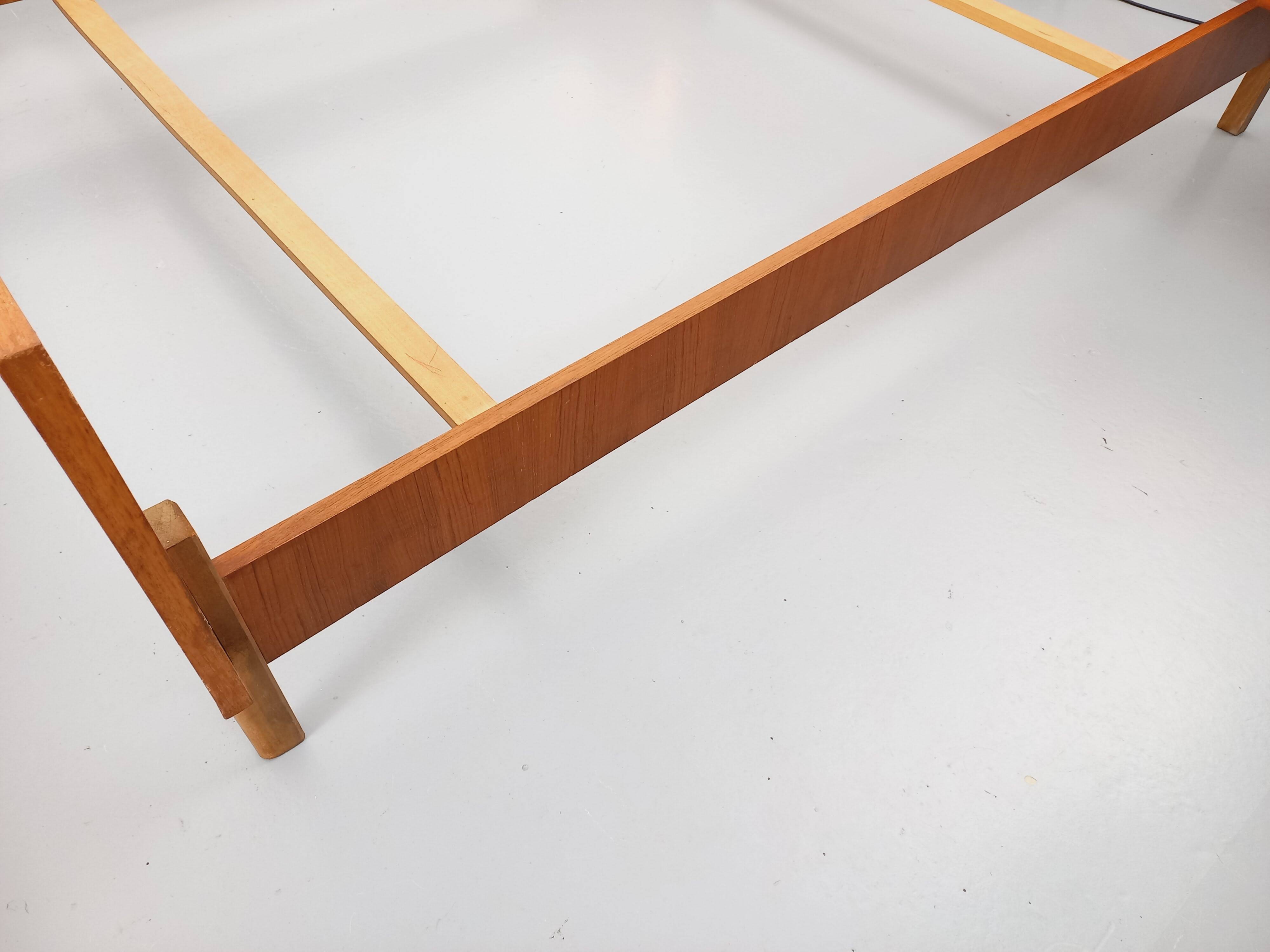 Vintage Scandinavian style double bed in teak from the 60s with integrated bedside lights