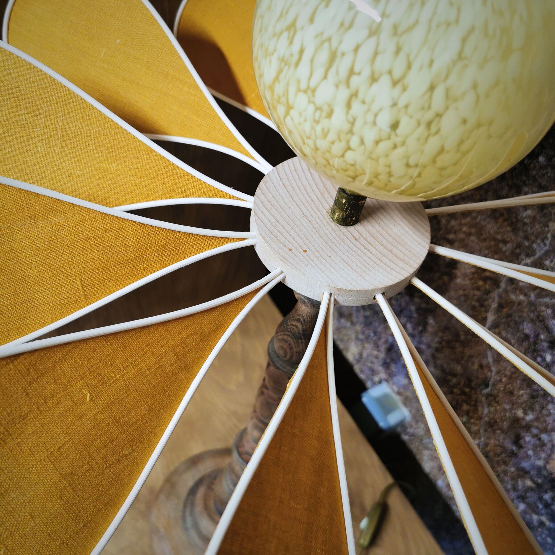 Turned wooden foot lamp and linen and rattan petals