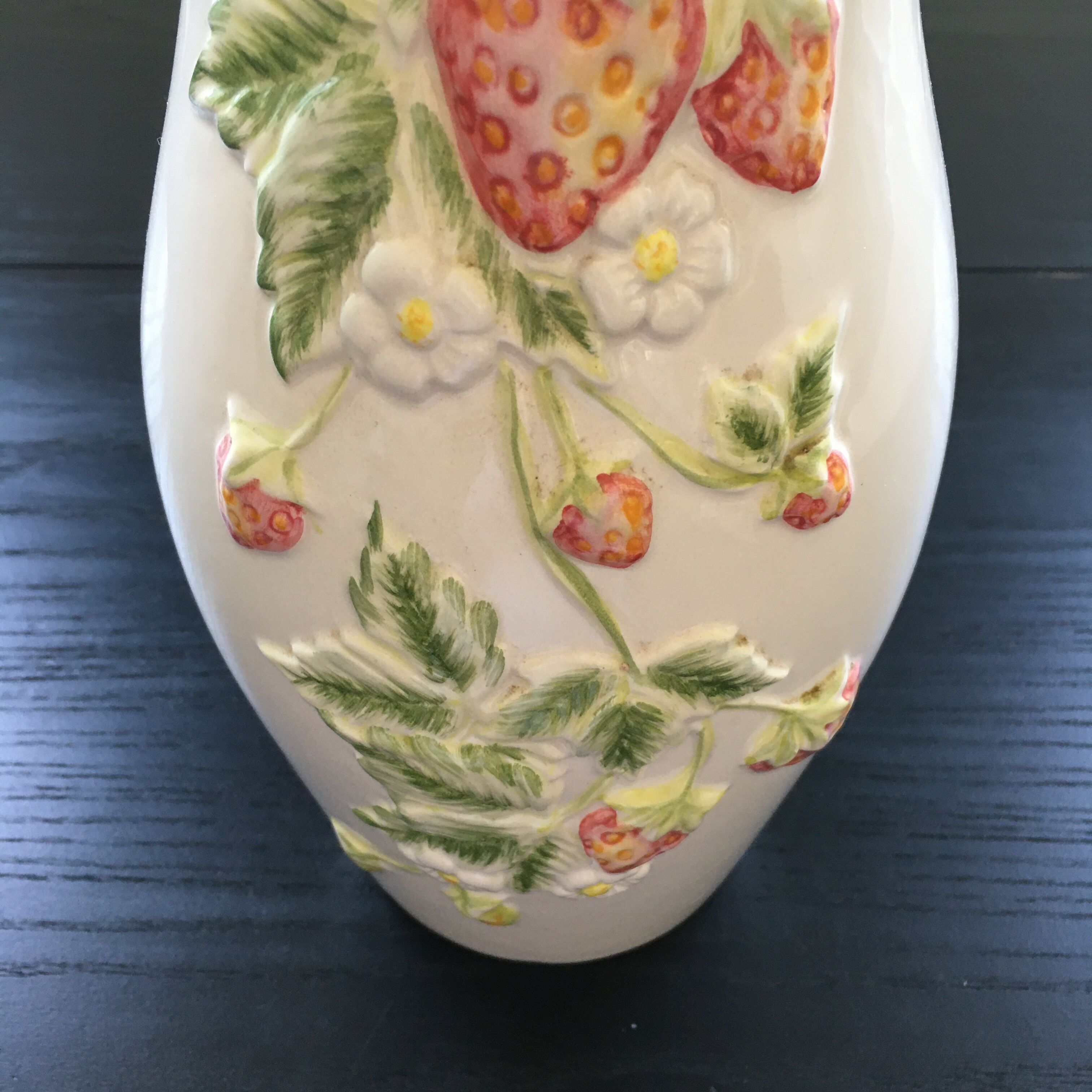 Vase decorated with strawberries in slip
