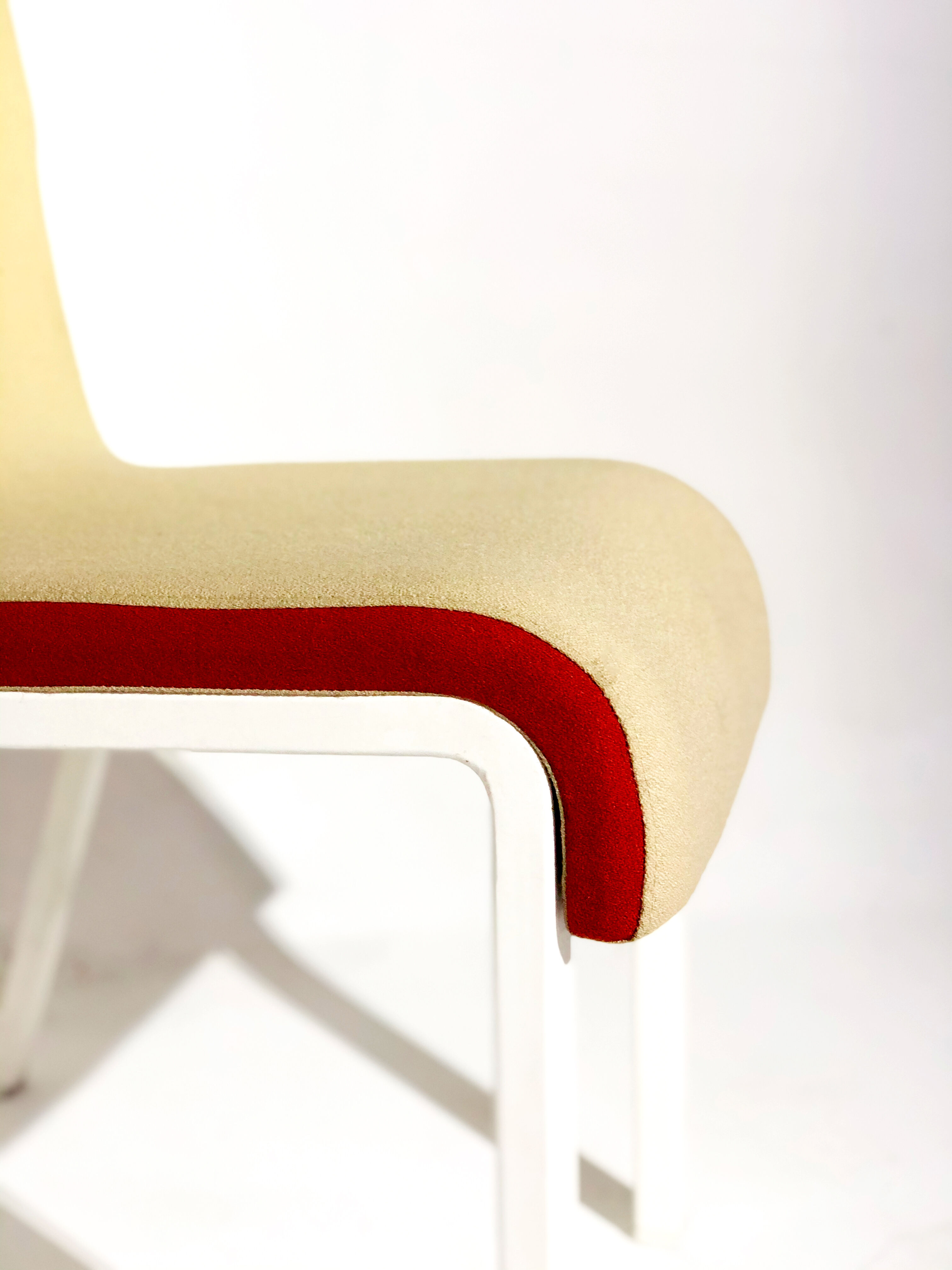 Contemporary design chair in white lacquered fabric and metal