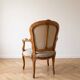 Pair of Louis XV/XVI armchairs in carved wood and floral fabric.