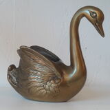 Empty brass swan pocket