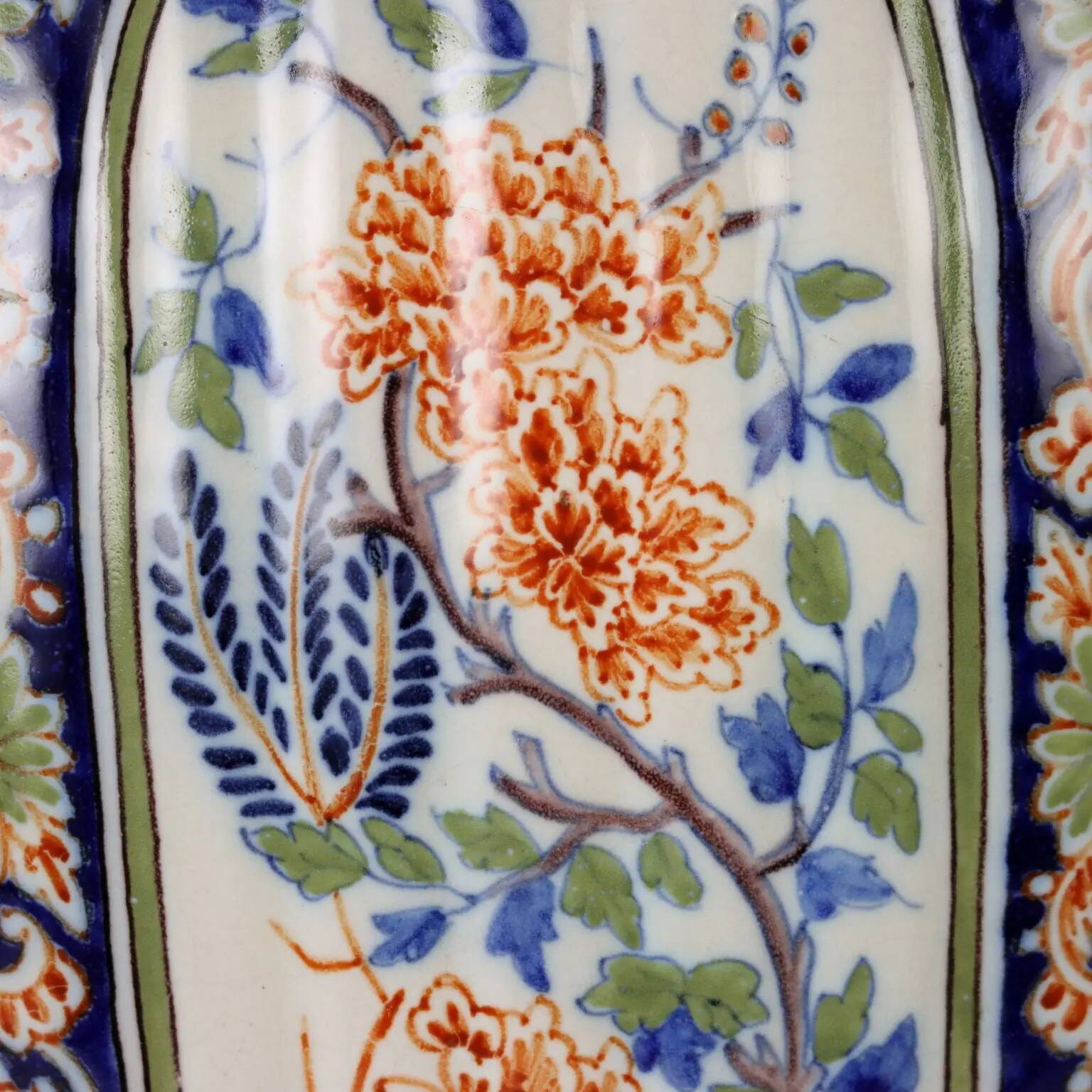 Ancient vase fully decorated with ceramic plants, 20th century.