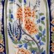 Ancient vase fully decorated with ceramic plants, 20th century.