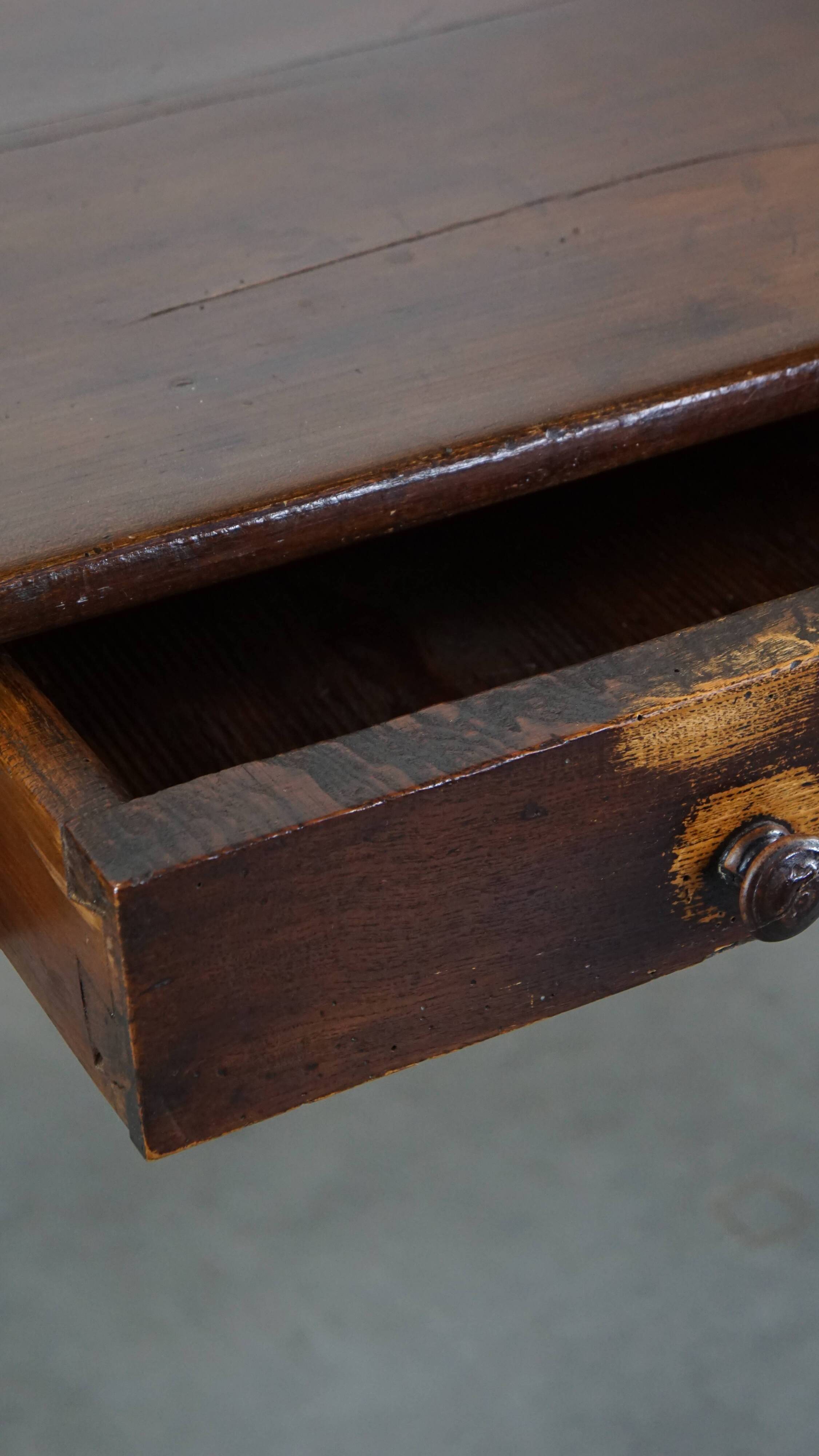Antique French fruitwood dining table with 2 drawers and patina