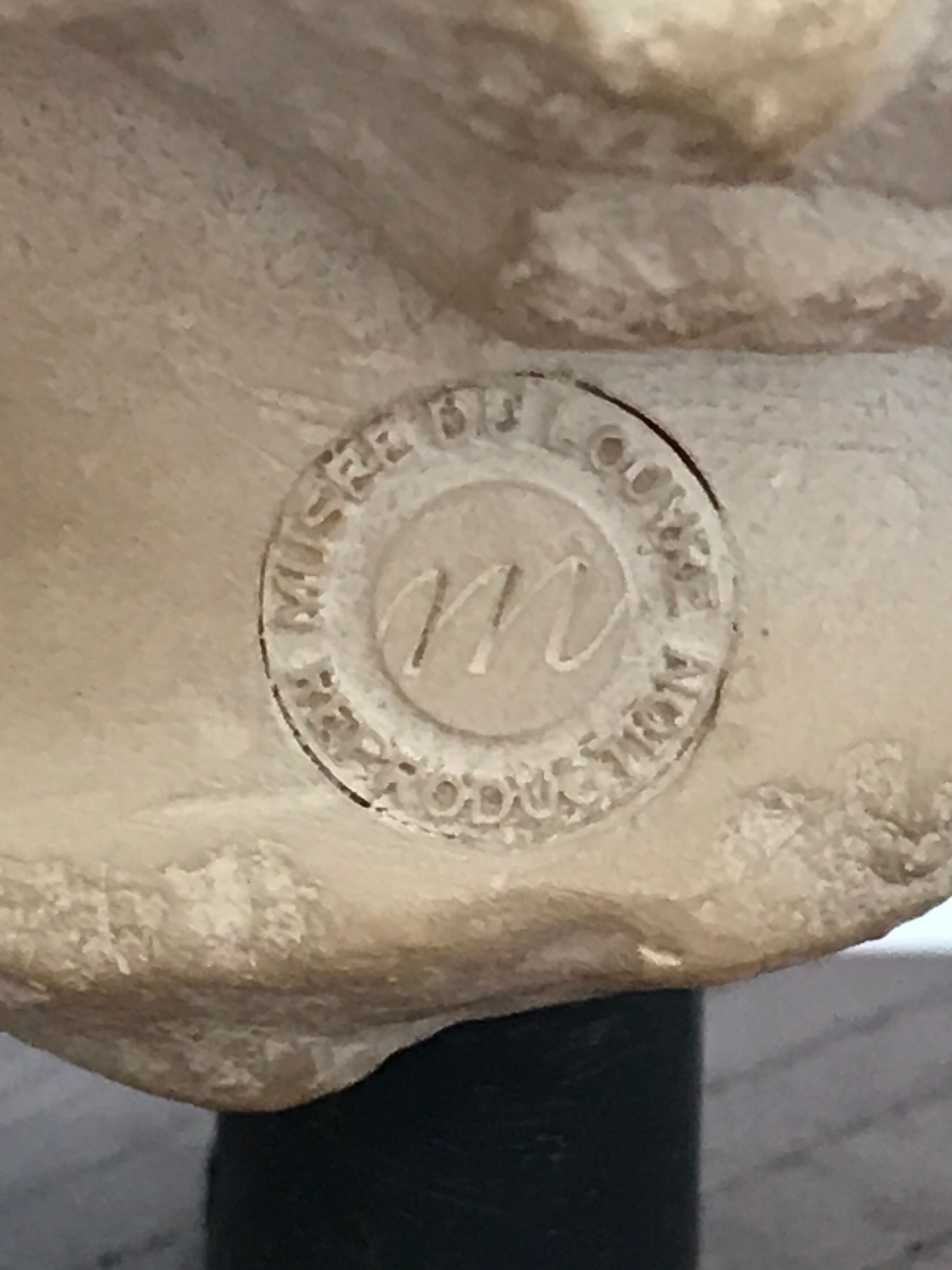 Bust angel head Louvre Museum