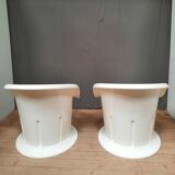 Pair of white plastic armchairs