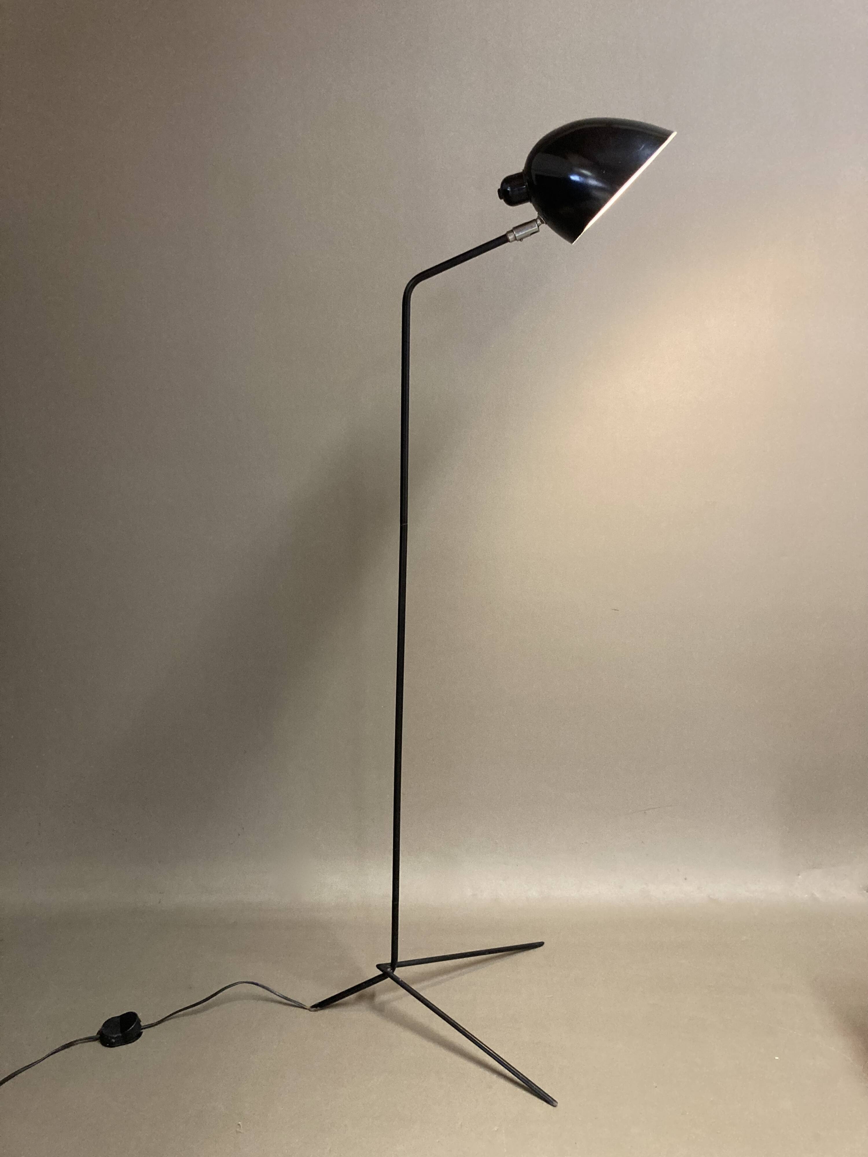 Black metal tripod floor lamp