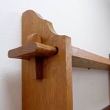 Wall shelves with dowels in Arts & Crafts style