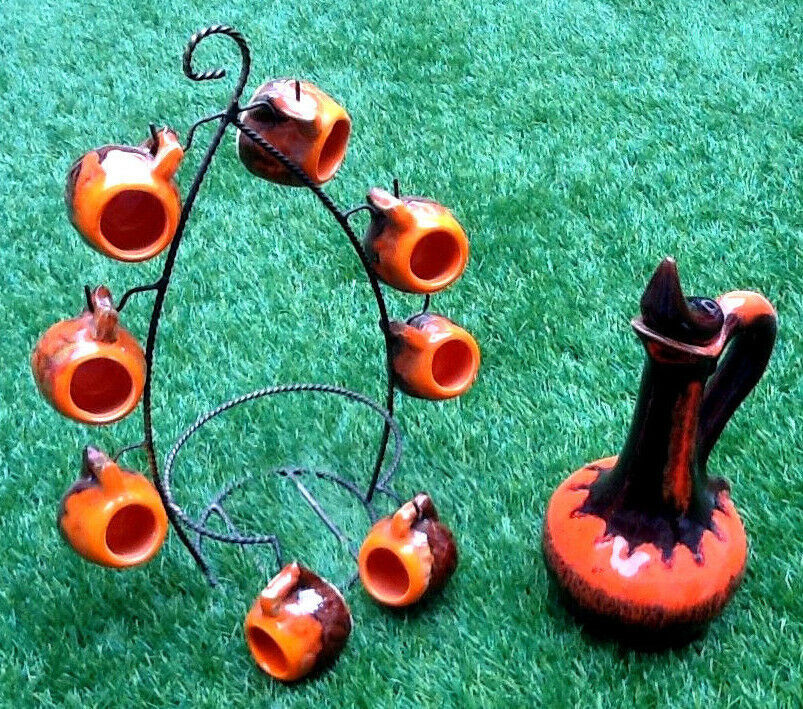 1960s-1970s liquor service including a decanter and 8 cups