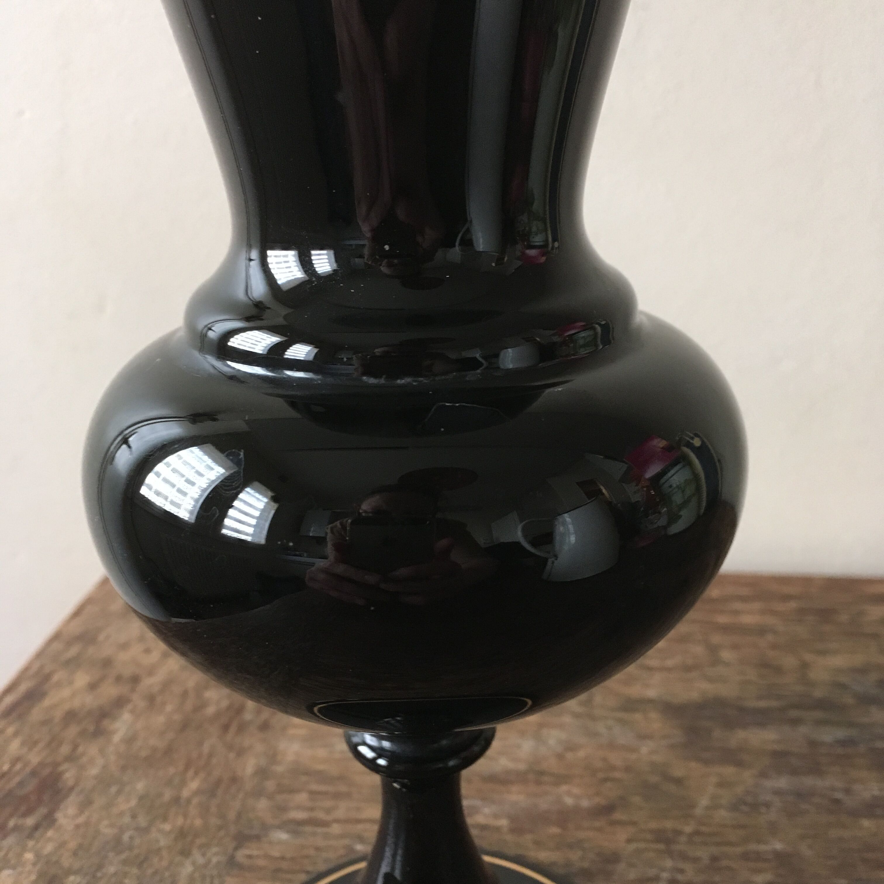 Large black vase with faience gold edging
