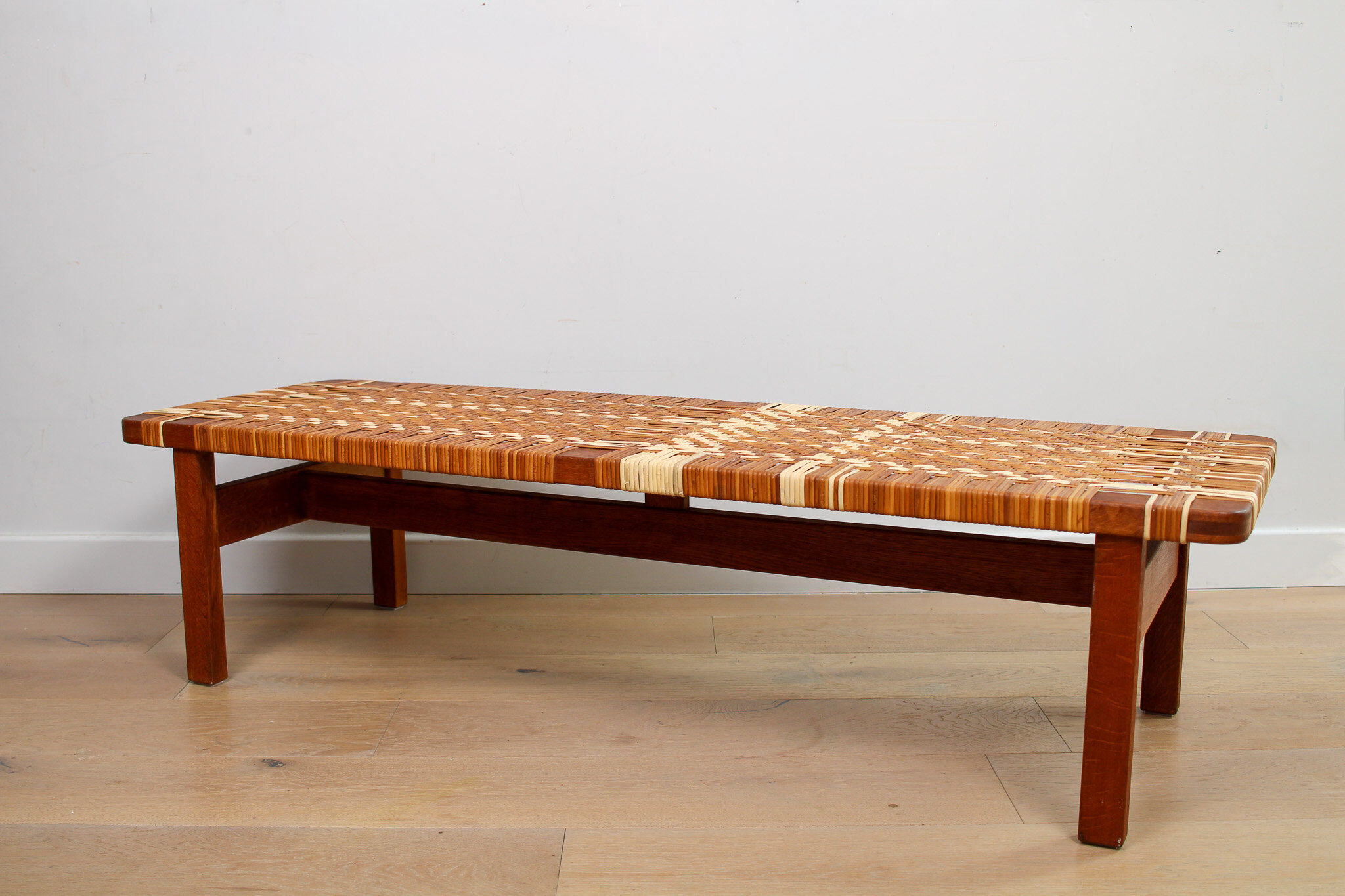 A vintage mid-century Danish Borge Mogensen 5272 rattan coffee table/bench