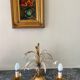 Golden metal chandelier decorated with flowers
