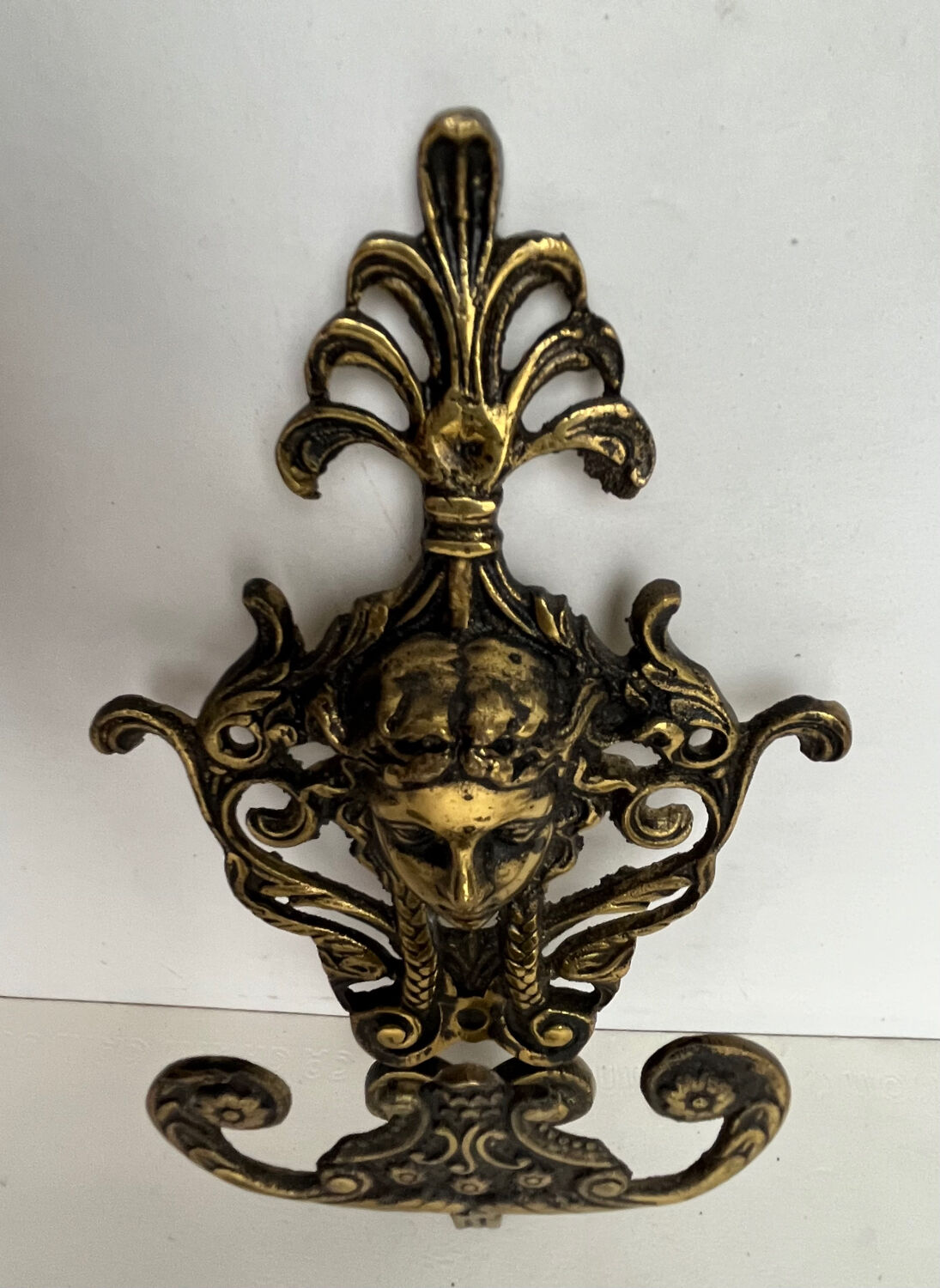 Antique hook in gilded bronze