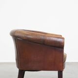 Sheep leather club chair finished with decorative nails