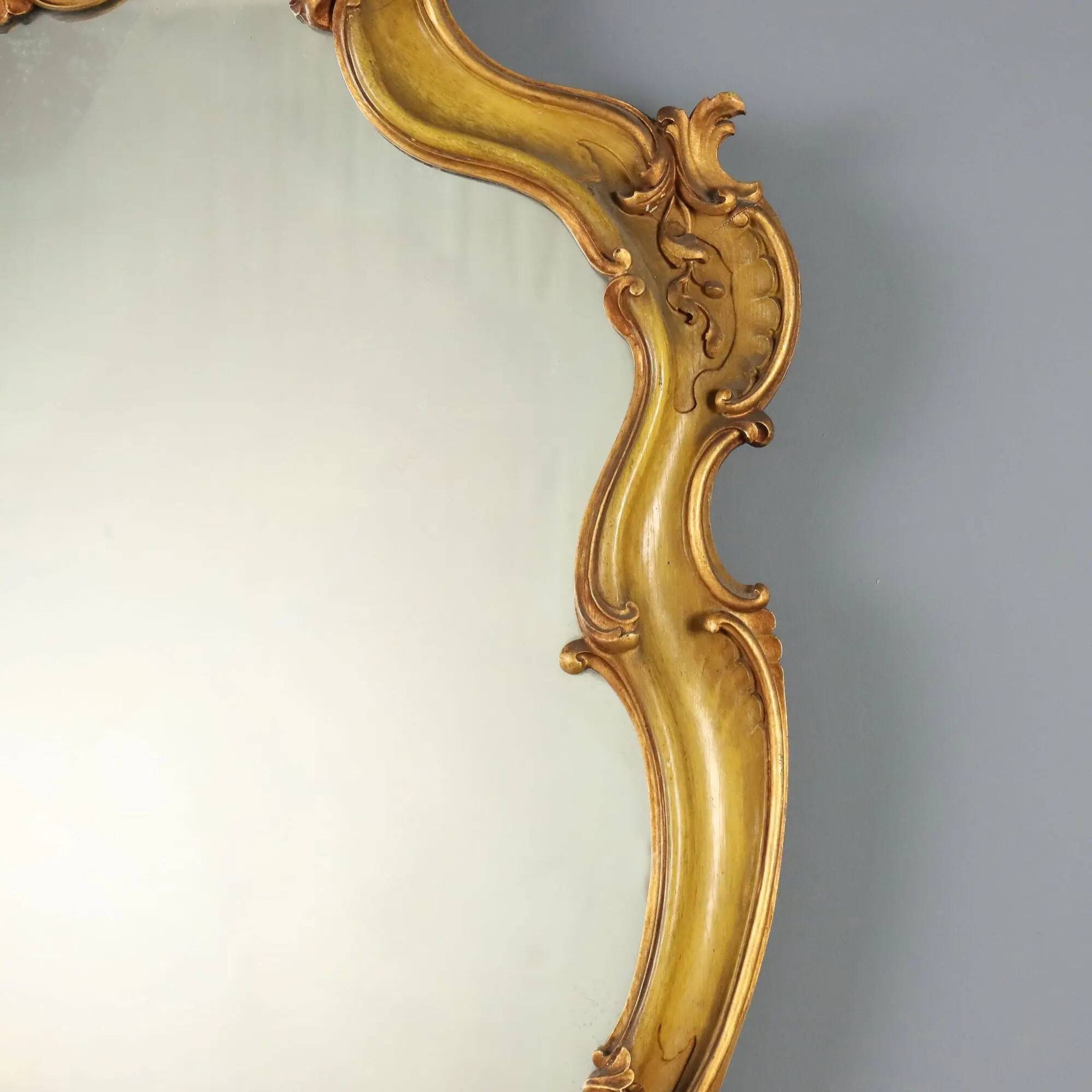 Antique baroque-style mirror in gilded carved wood, Italy 19th century.
