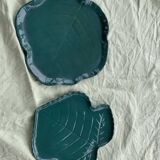 Two dishes empty pocket slurry, biscuits in the shape of vintage green leaf