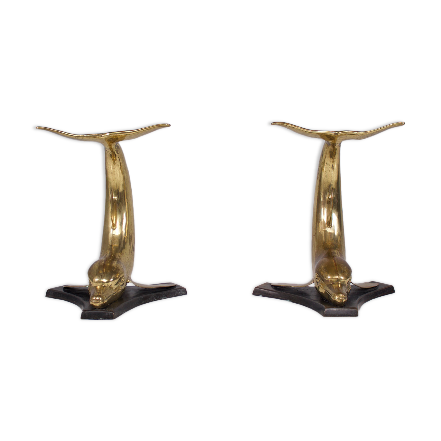 Solid brass dolphin console feet.