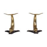 Solid brass dolphin console feet.
