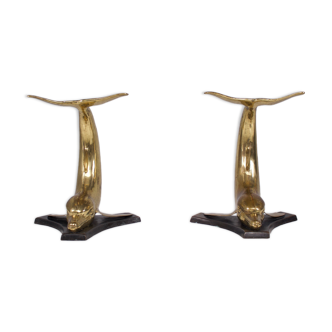 Solid brass dolphin console feet.