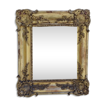 Baroque mirror late 19th century in wood and gilded gypsum.