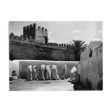 Women in white under the ramparts of Fez around 1930