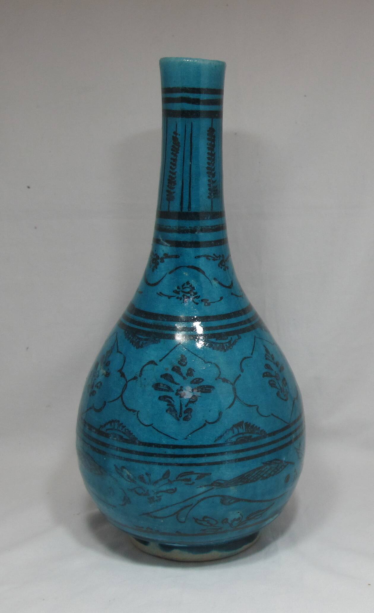 Islamic ceramic vase with turquoise background