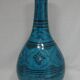 Islamic ceramic vase with turquoise background