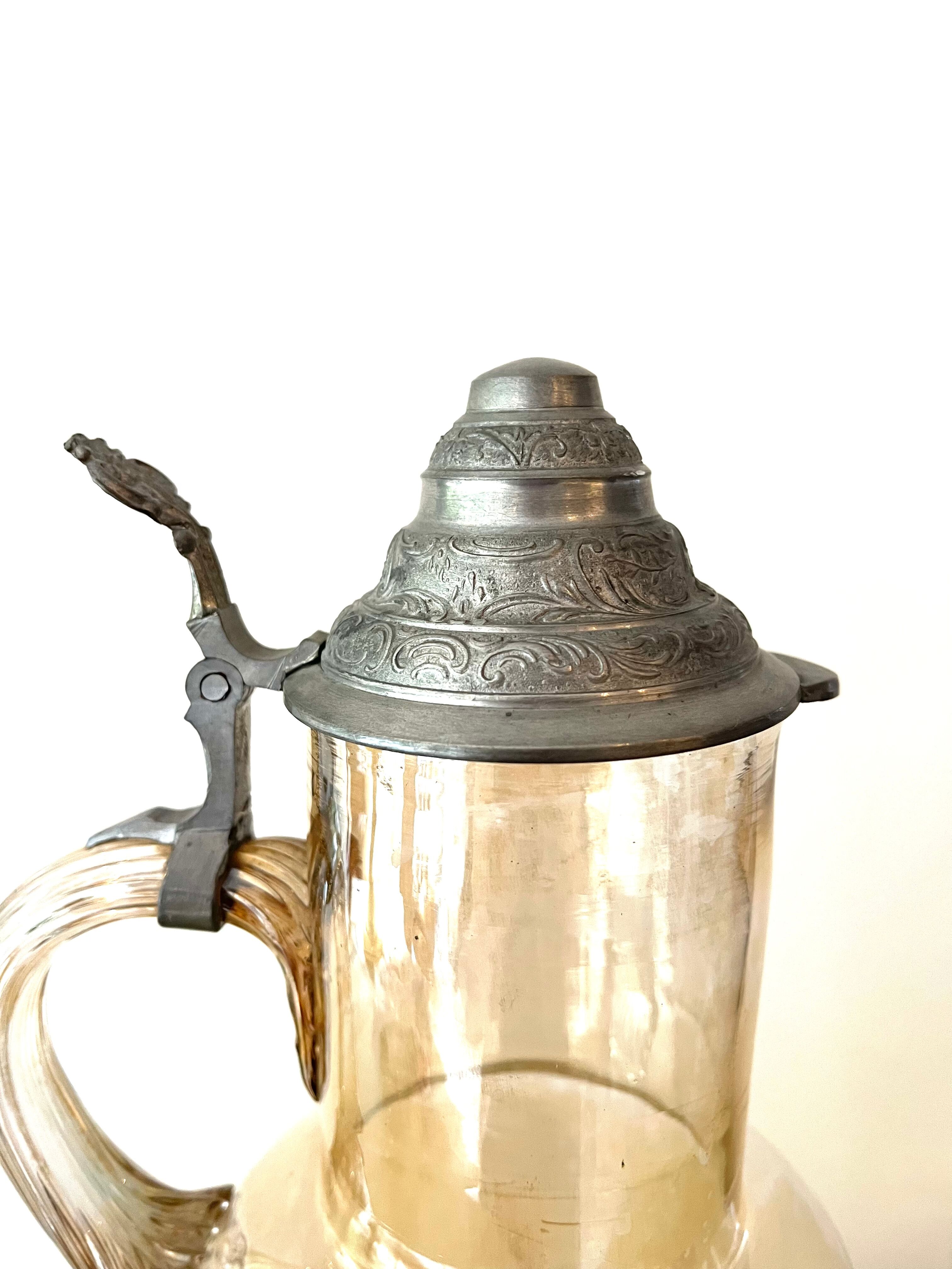 Vintage glass and tin jug