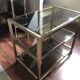 Vintage brass serving trolley with smoked glass trays.