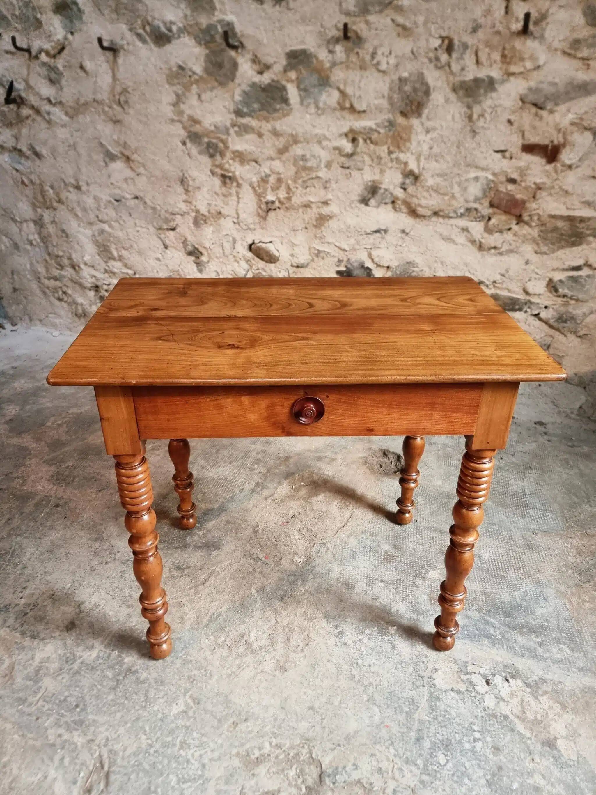 Small antique French writing table in walnut with a drawer, around 1900.