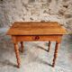 Small antique French writing table in walnut with a drawer, around 1900.