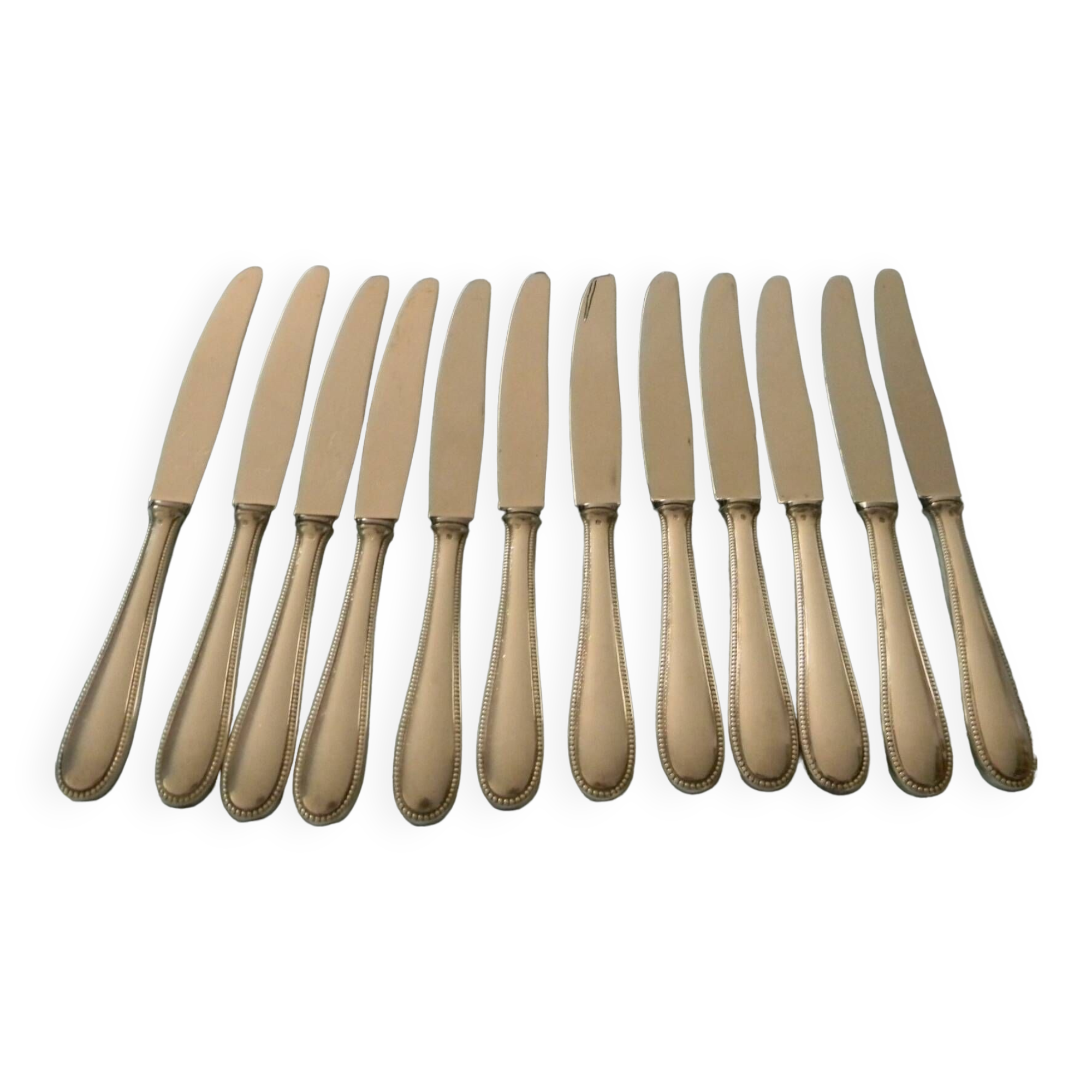 Set of 12 cheese or fruit knives with silver metal handles.