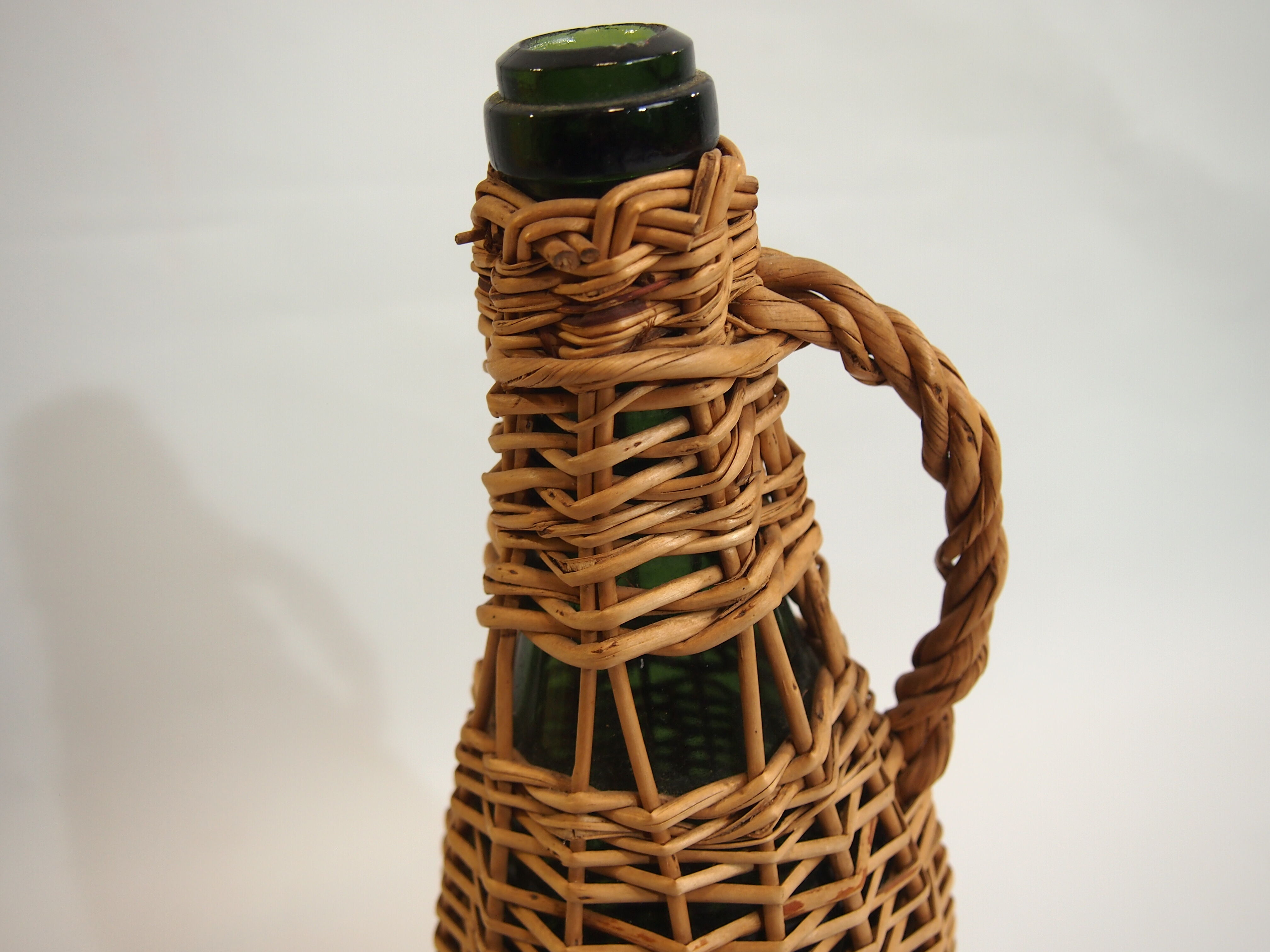 Bottle dressed in rattan