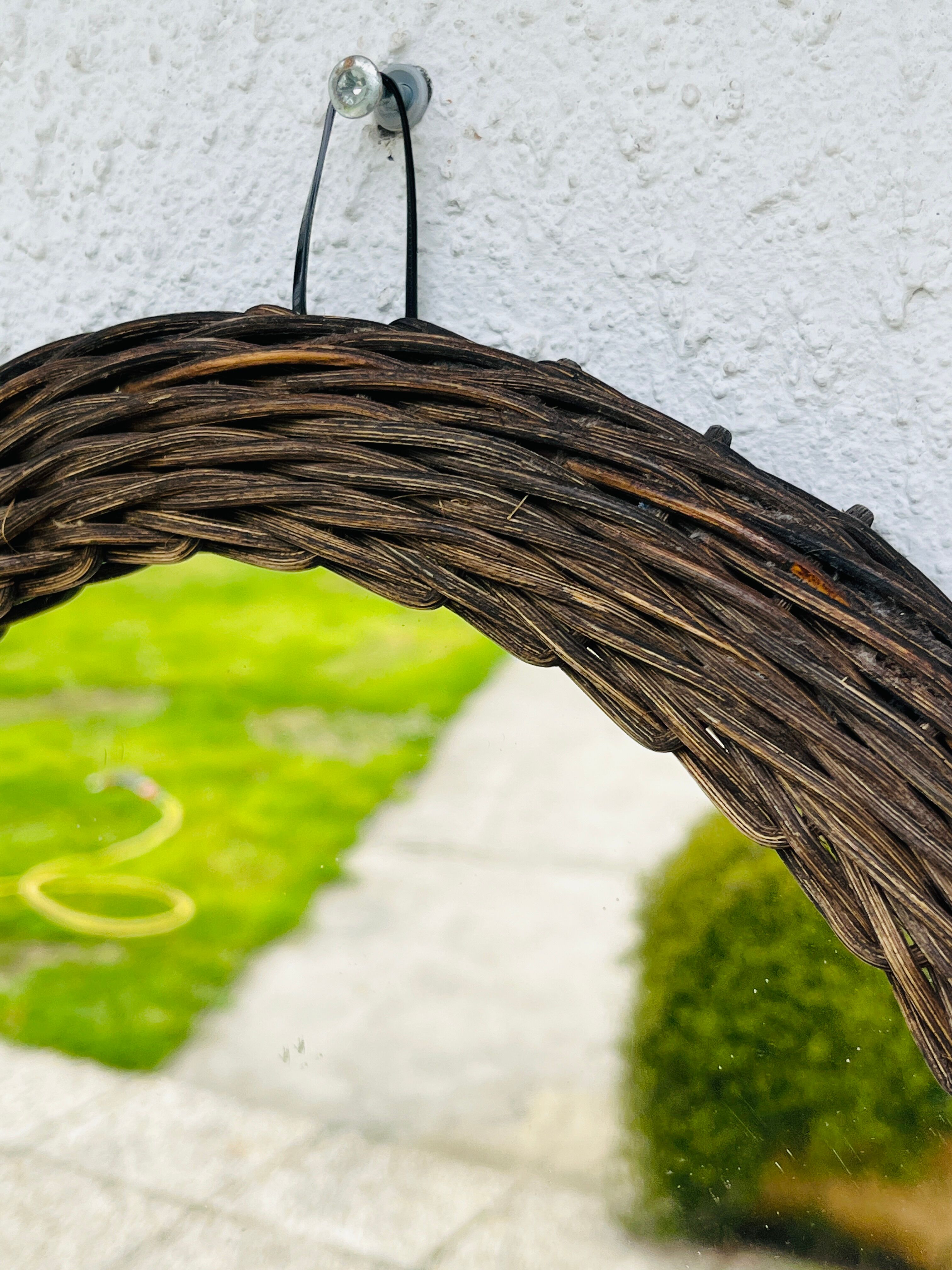 Vintage sun mirror in woven wicker