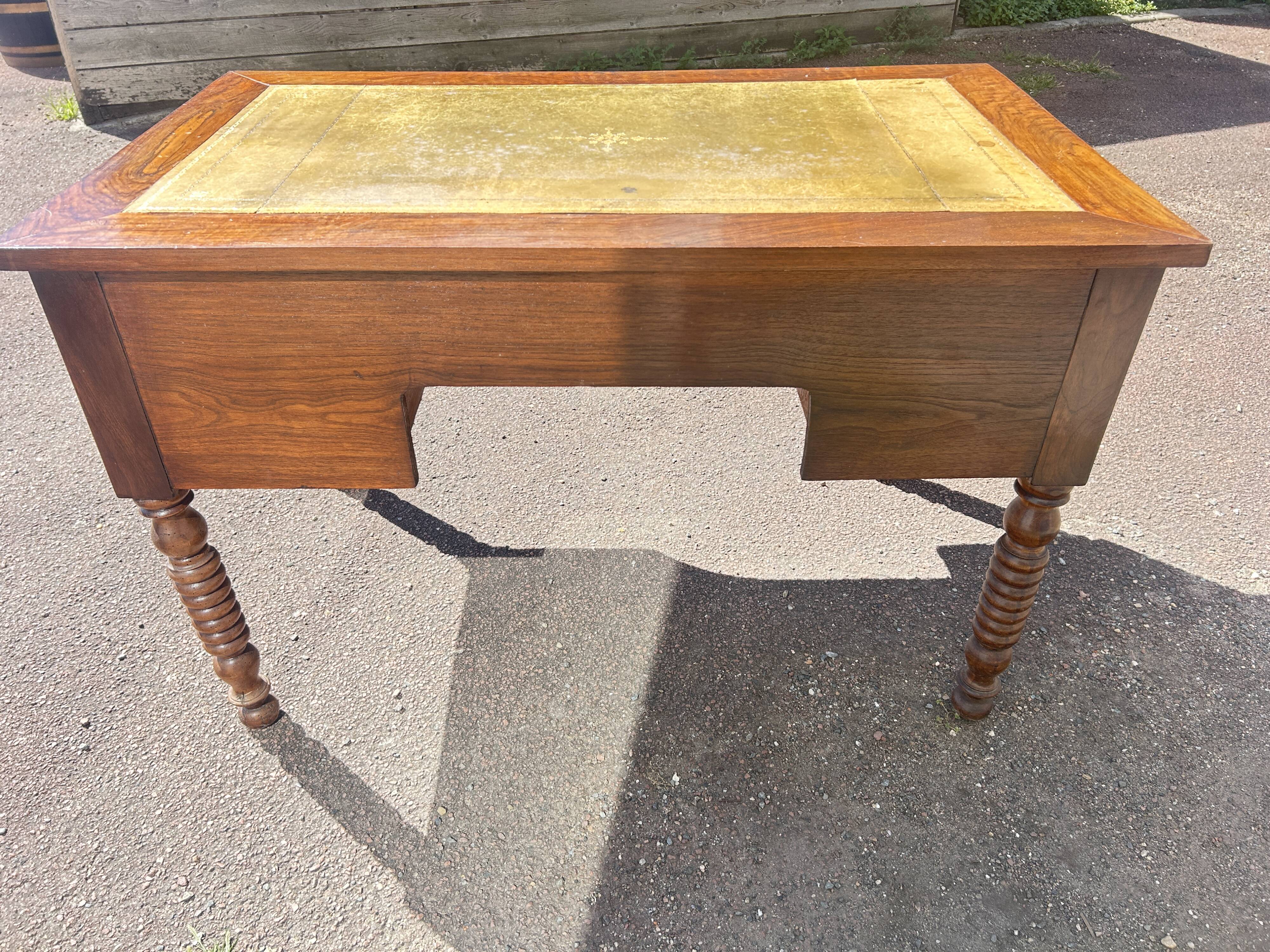 Louis Philippe desk in walnut, with a leather top.