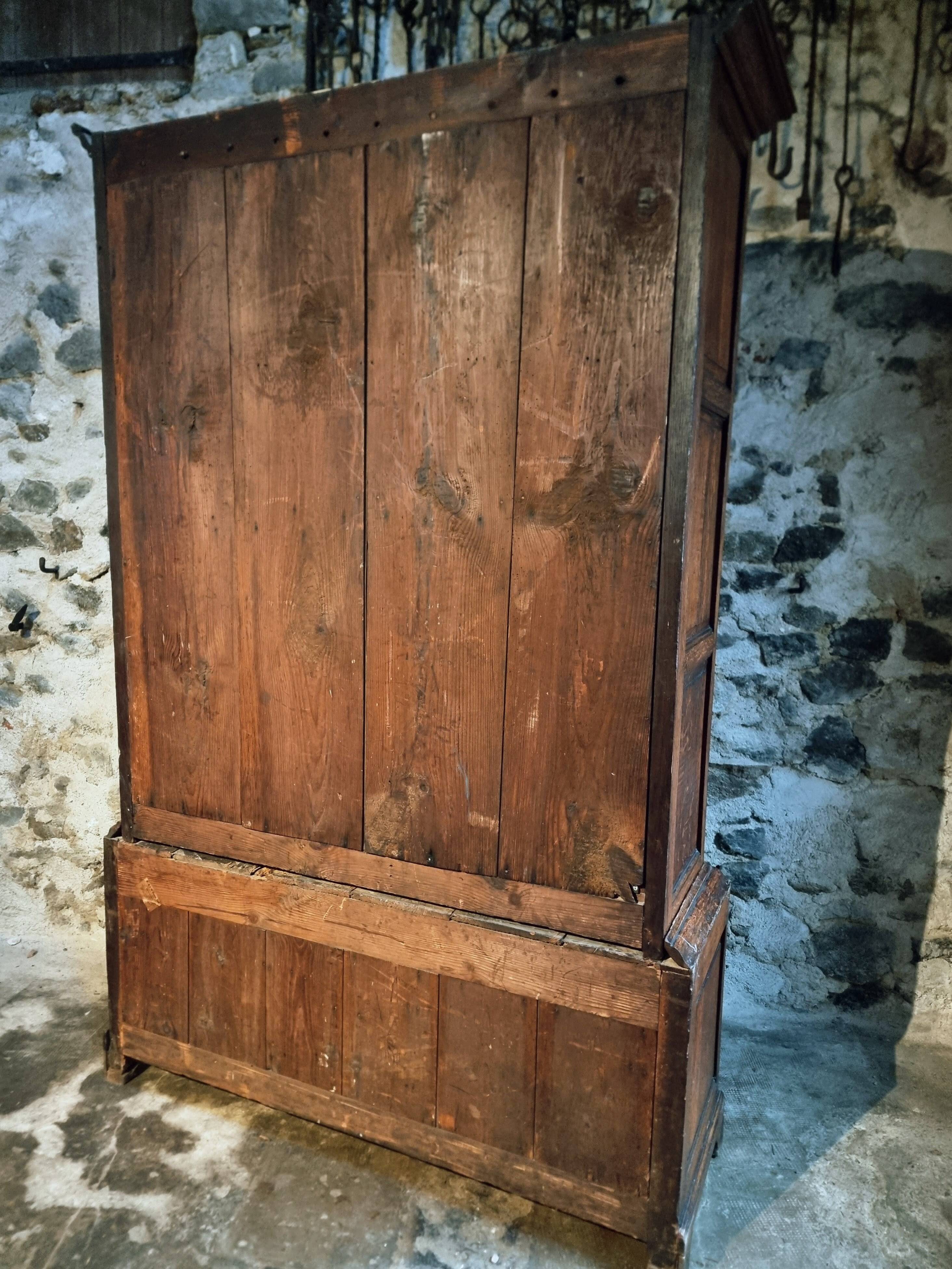 Antique English oak wardrobe with drawers, England, circa 1800–1820.