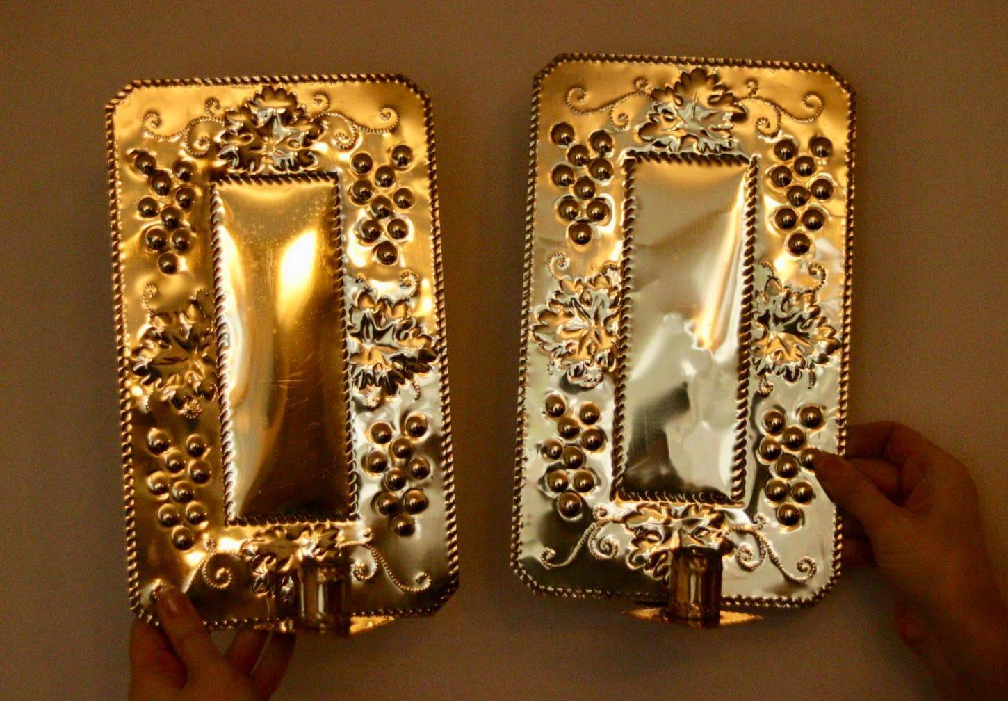 A pair of Swedish brass wall sconces from the mid-century.