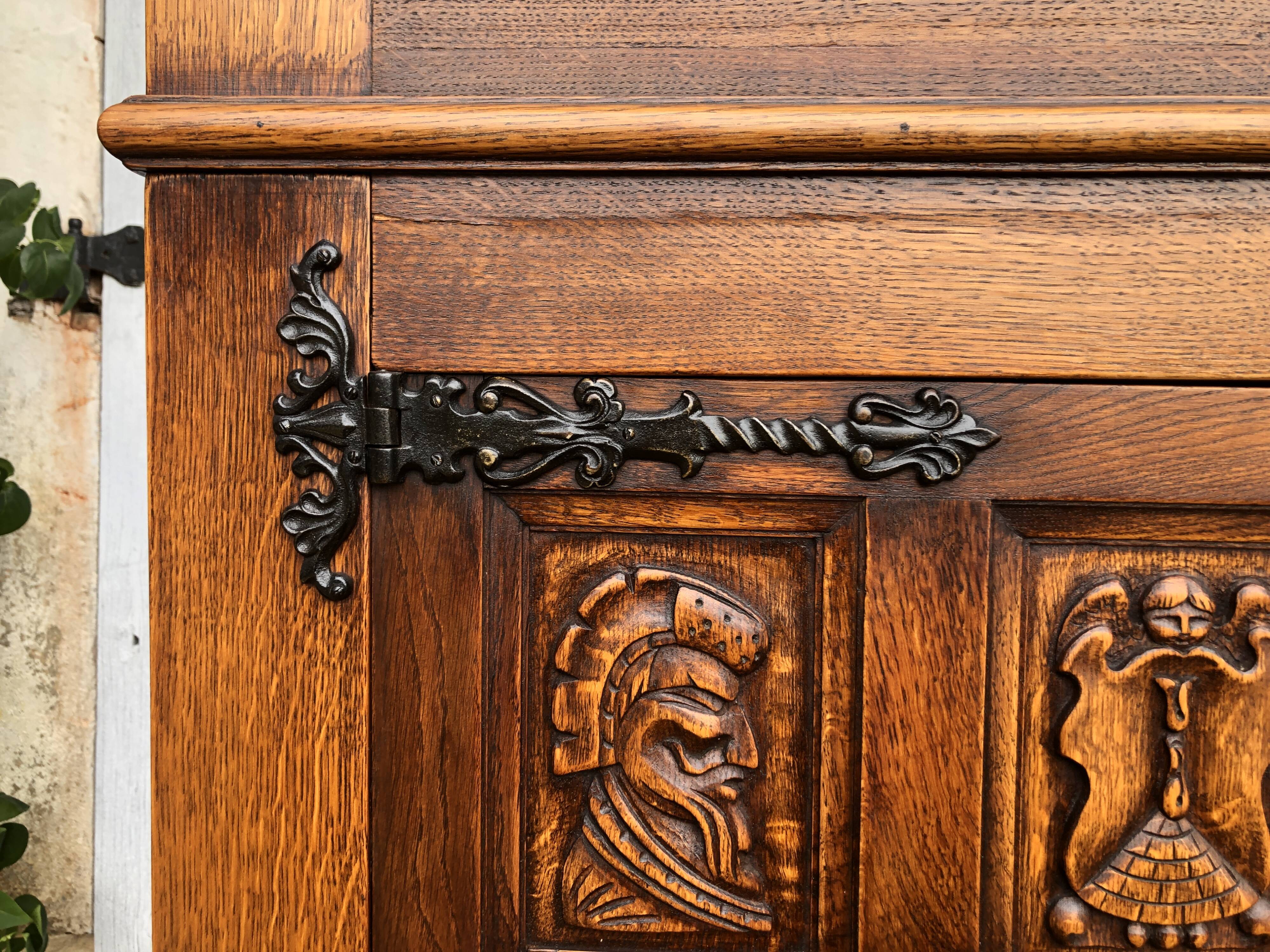 Spanish furniture with carved wood profiles and coats of arms from the 1950s.