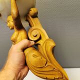 Wall lamp, where the base is a carved wooden lady holding the shade which is made of alabaster 1920s