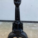 Pair of cast iron chenets with stylized faces High Epoch SEVENTEENTH century